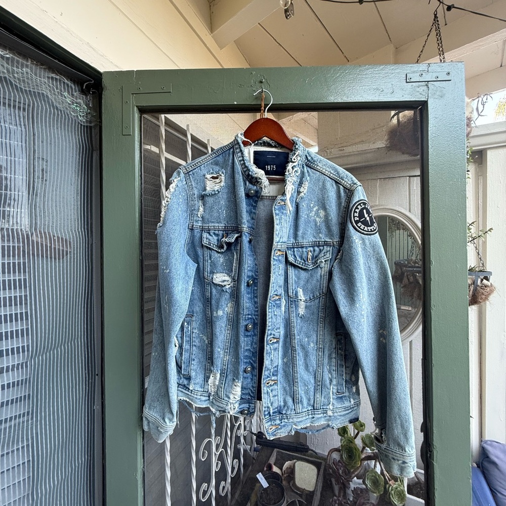 Distressed Denim Jacket with Patch